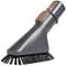 A grey brush nozzle with black bristles, attached to a vacuum cleaner attachment, for cleaning surfaces.
