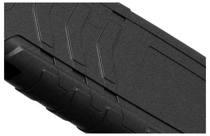 Close-up of a structured, black plastic casing with a ribbed grip area.