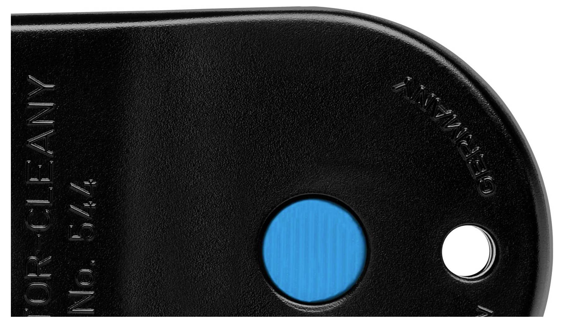 Close-up of a black plastic component with cut-outs and a blue marking. Text 'GERMANY' and serial number engraved.
