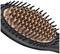 Close-up of a hairbrush with black bristles and a copper-coloured head. Key feature: evenly distributed bristles.
