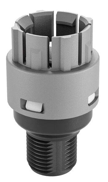 Grey, cylindrical metal head with serrated top surface and screw thread at the lower end. Component of a mechanical tool.