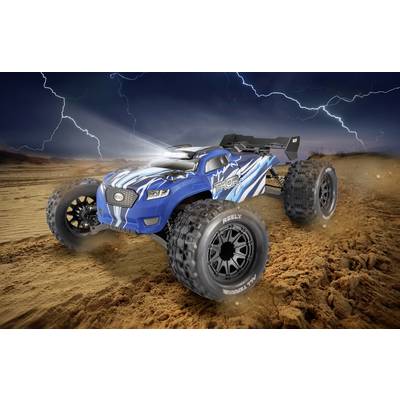 A blue toy truck dynamically drives through a desert landscape with lightning and a dark sky, suggesting tension and adventure.