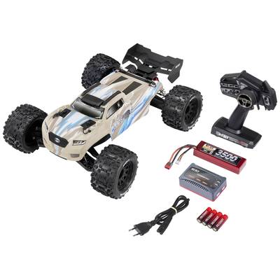 Remote-controlled car with charger, remote control, batteries, and mains plug. The car has large off-road tyres and a sporty design.