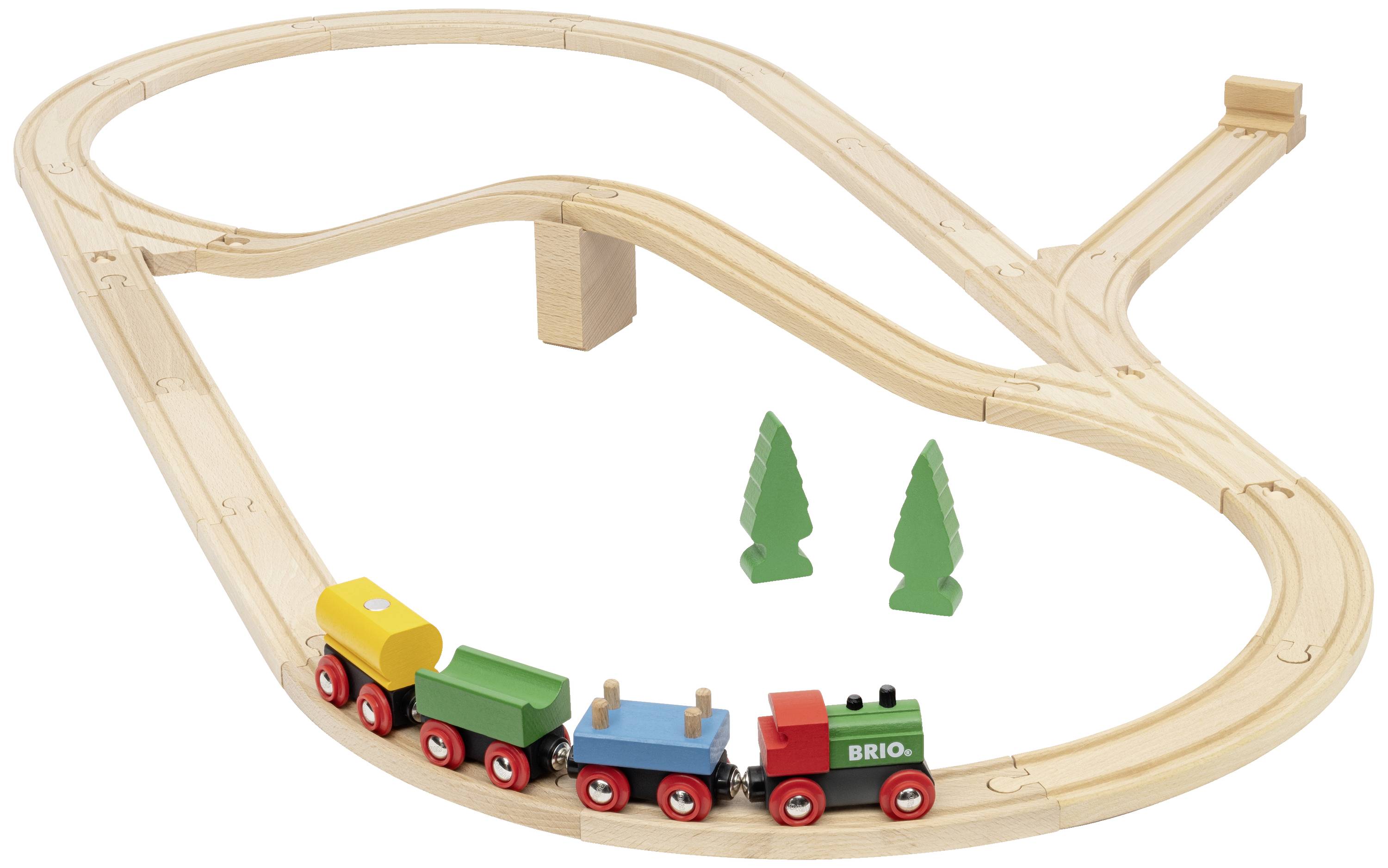Wooden train set with tracks in a loop, three colourful carriages, and two green pine trees.