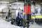 In a production facility, a red warning signal is illuminated in front of machines, indicating a potential stop or error.