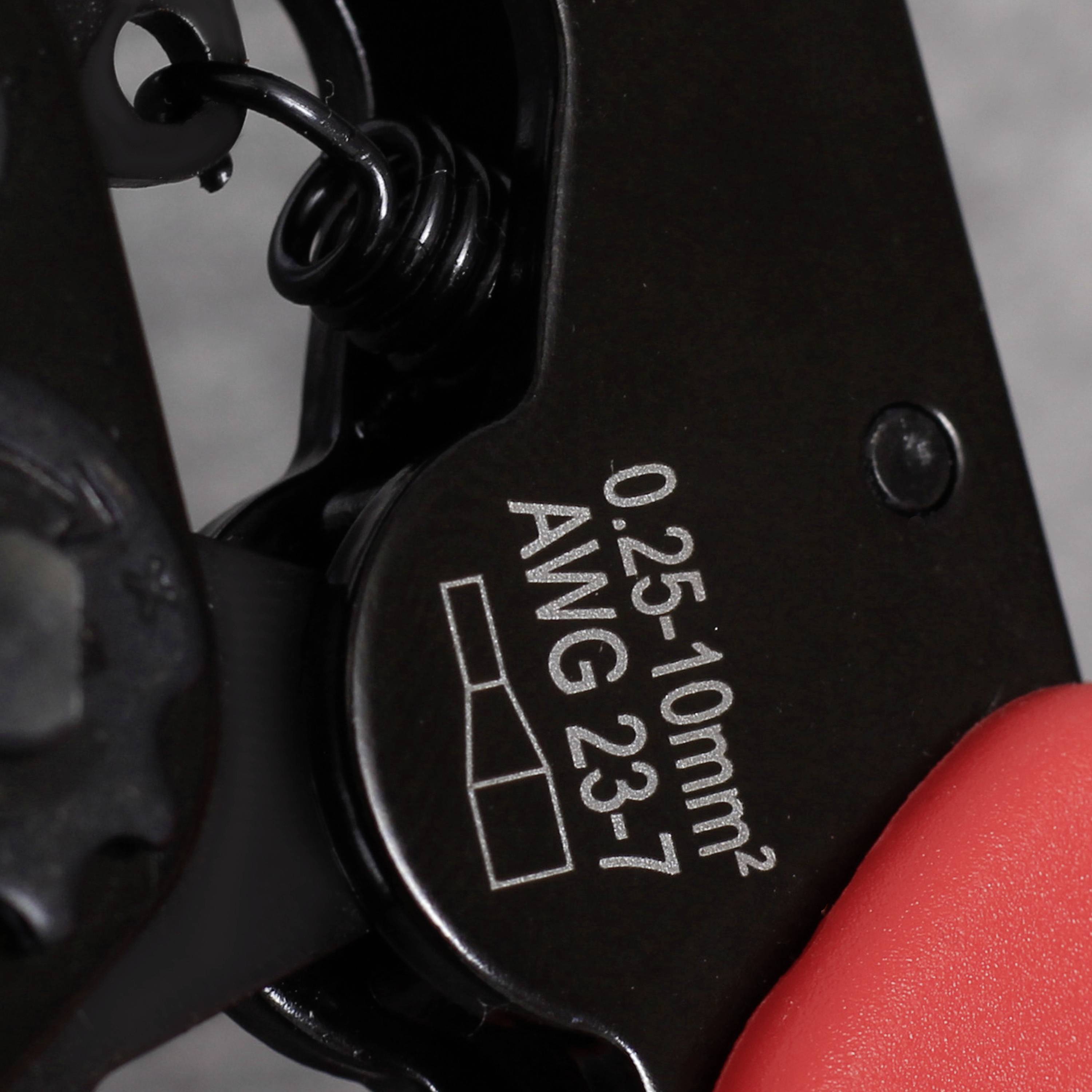 Close-up of a crimping tool with markings '0.25-10mm² AWG 23-7', showing a precision tool for electrical work.