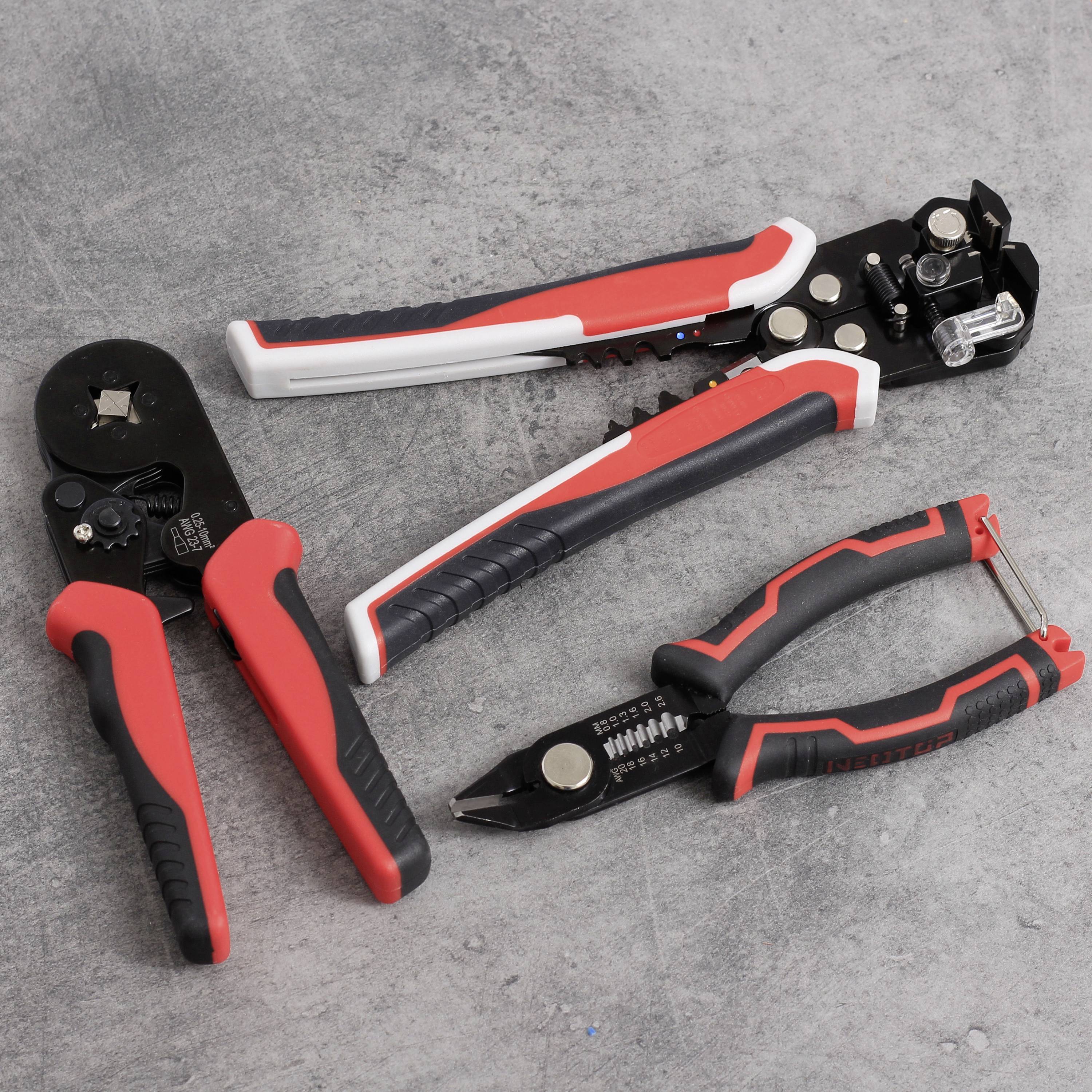 Three hand tools lie on a grey background: a red pair of pliers, a black wire stripping tool, and a cable cutter.