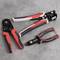Three hand tools lie on a grey background: a red pair of pliers, a black wire stripping tool, and a cable cutter.