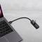A laptop with a connected USB hub, to which multiple devices can be connected.