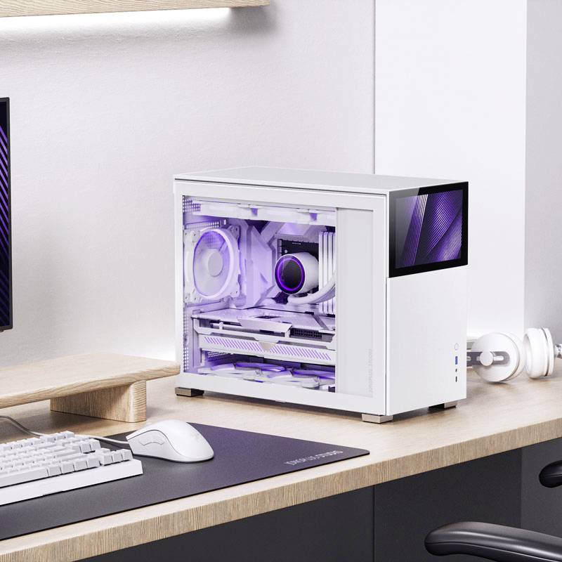 A compact, white desktop computer with visibly purple-illuminated components inside sits on a desk next to a keyboard.