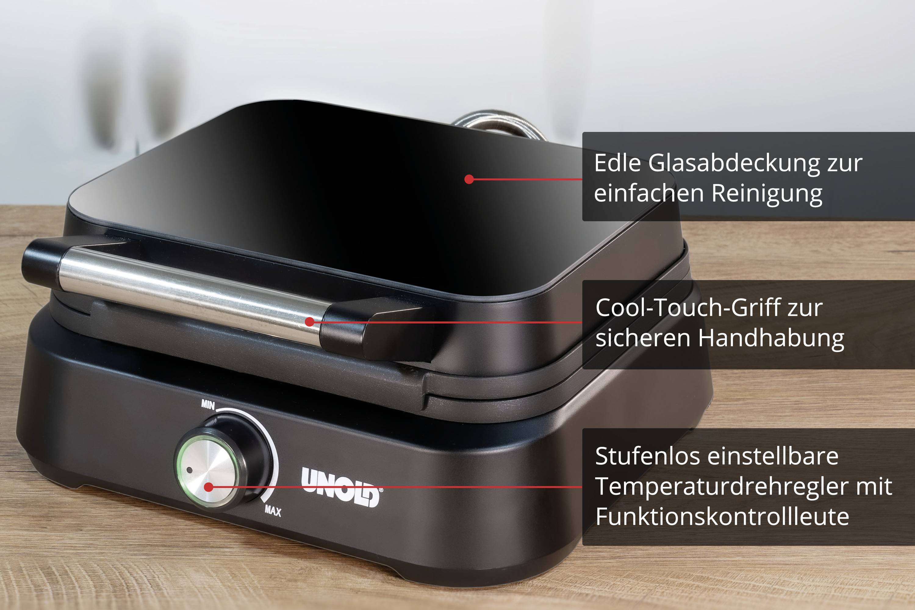 An electric appliance with a glass cover, cool-touch handle, and a temperature control with a function indicator light for safe cooking.