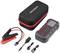 A portable charging set with housing, cables, and clamps. Contains a red and black charger with accessories.