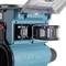 Makita XGT battery is inserted into a charger; robust construction, suitable for high-performance power tools.