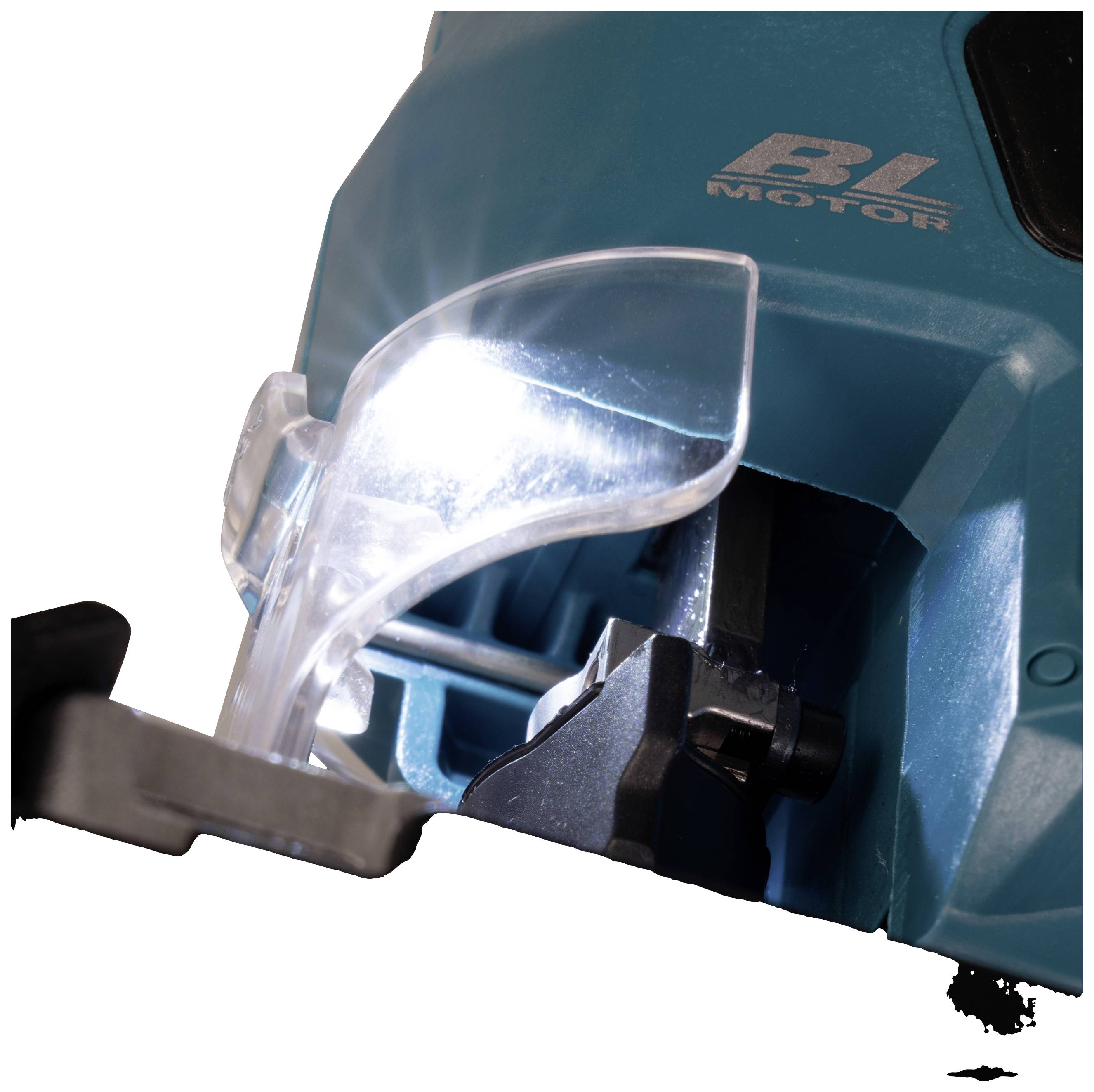 Close-up of an electric power tool with a transparent protective cover, brightly lit, showing a blade or similar component.