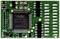 A green electronic component with numerous connections and a central microchip, labelled with technical details.