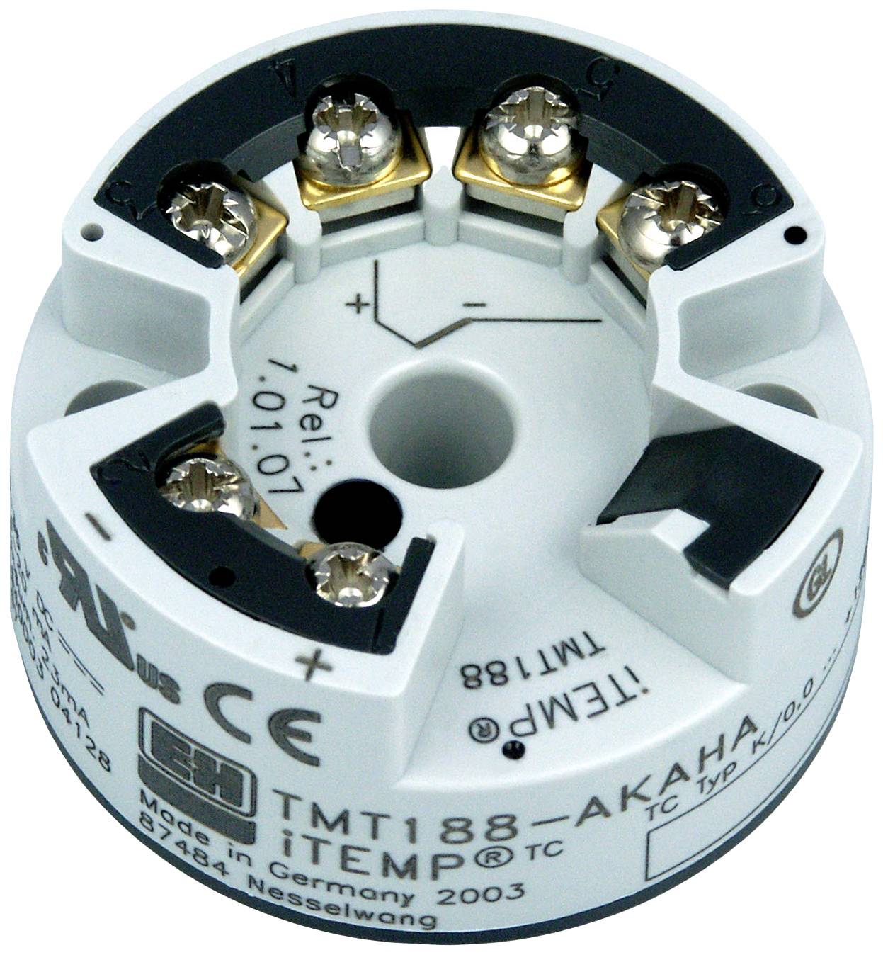 A round temperature transmitter with connection terminals and label 'TMT188'. Manufactured in Germany, inscription 'iTEMP'.
