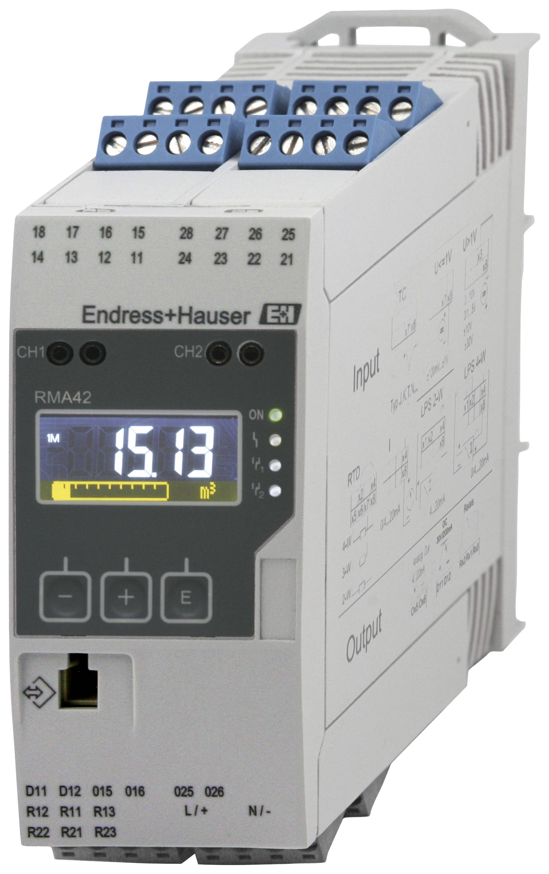 An electronic device from Endress+Hauser displays '15.13' on the screen, with input and output connections and control buttons.