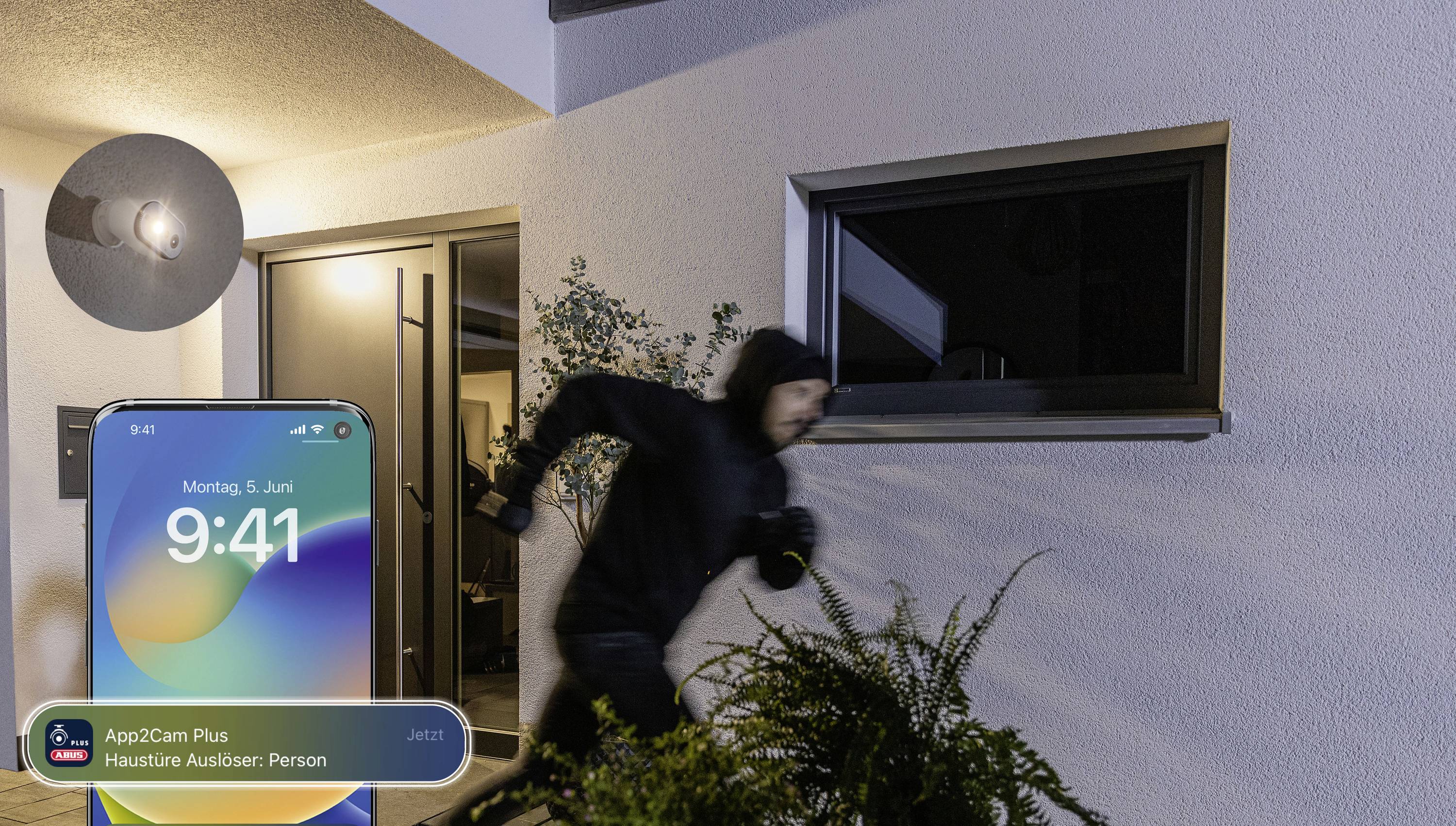 A masked person is running away from a house at night. Next to the image is a smartphone screen displaying an alarm notification.