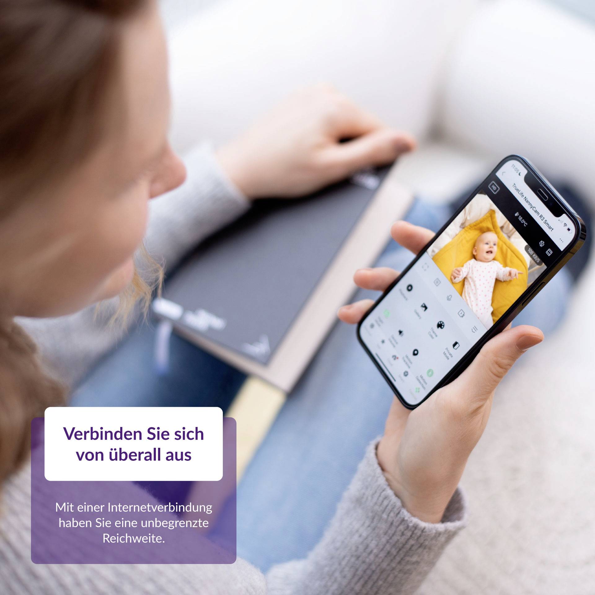 A person is holding a smartphone with a baby on the screen. Text in the corner says: 'Connect from anywhere'.