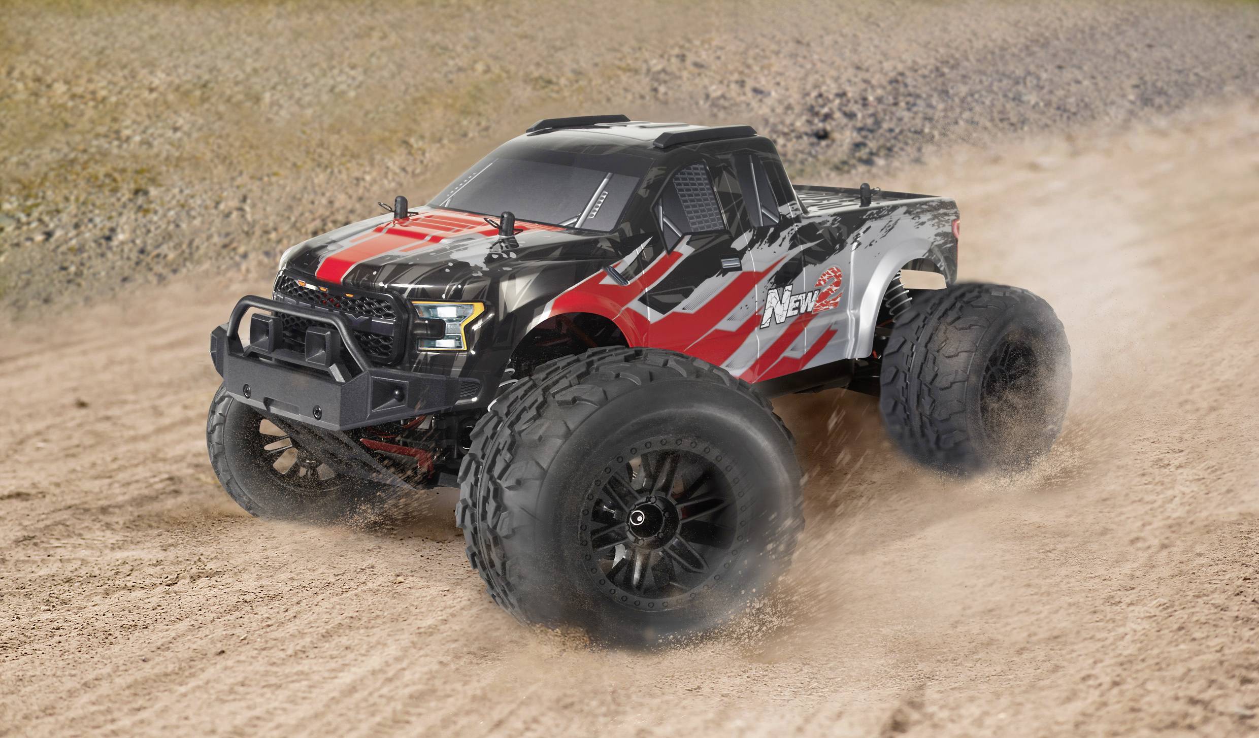 A remote-controlled car speeds across a dusty off-road track. The vehicle is finished in red and black.