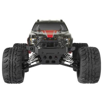 Remote-controlled monster truck with large, chunky tyres, robust bumper and black-red body design, photographed from the front.