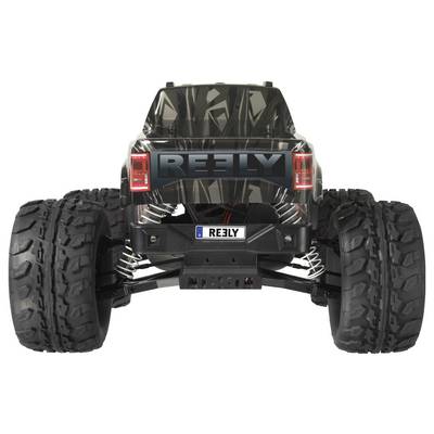 A remote-controlled car in black design with large off-road tyres, viewed from behind, bears the 'REELY' logo.