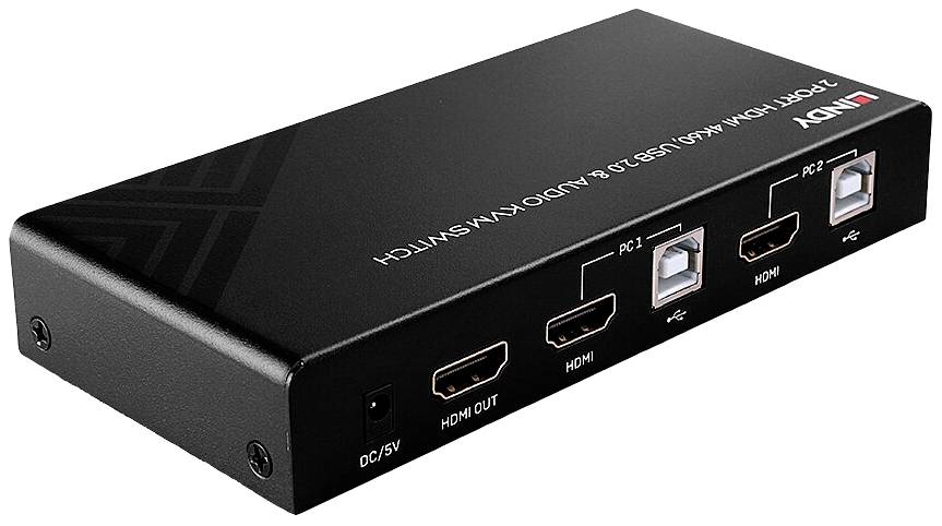 A black KVM switch by Lindy with 2 HDMI ports and two USB ports, suitable for connecting two PCs to a single monitor.