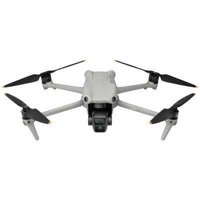 Grey drone with four propellers and a camera on the front. It is standing against a white background.