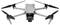 Grey drone with four propellers and a camera on the front. It is standing against a white background.