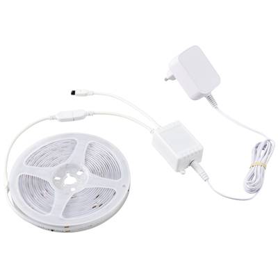 A roll of LED light strip with power supply and cable, ready for installation, shows the interior lighting system.