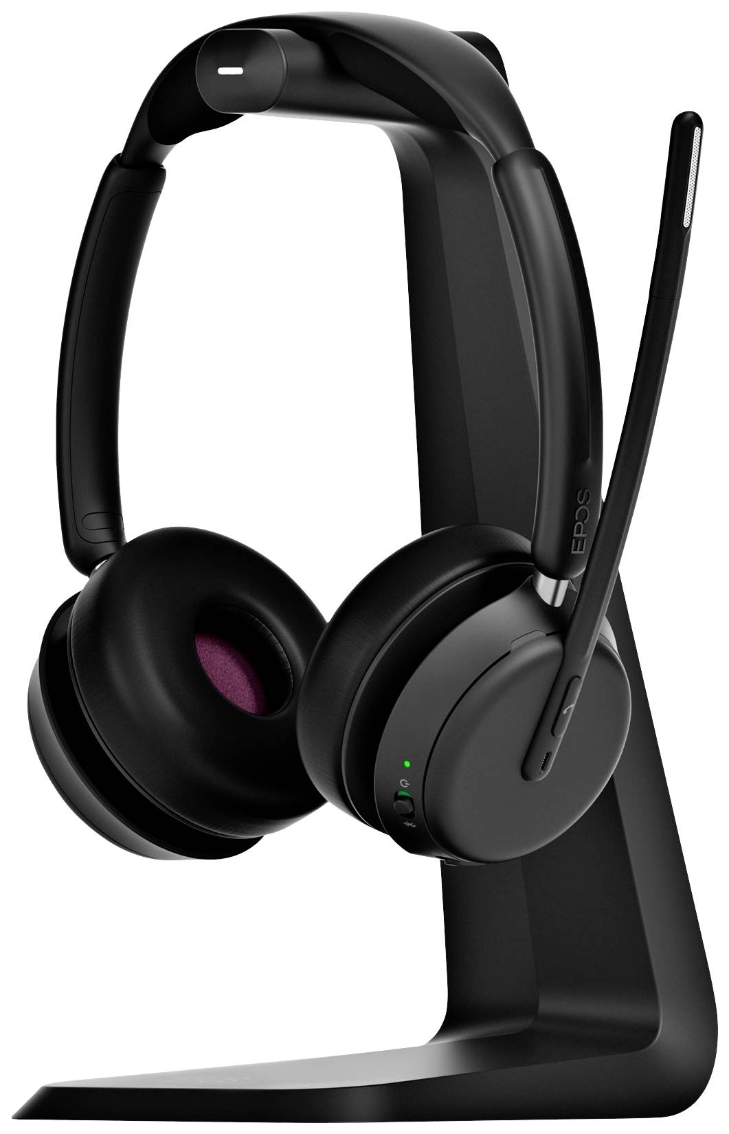Wireless black headset on a stand, with a long microphone arm. Positioned to the left, suitable for phone calls and music.