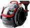 'Portable carpet cleaner with transparent water tank, black and red casing, and flexible suction hose, model 'SpotClean Pro'.'