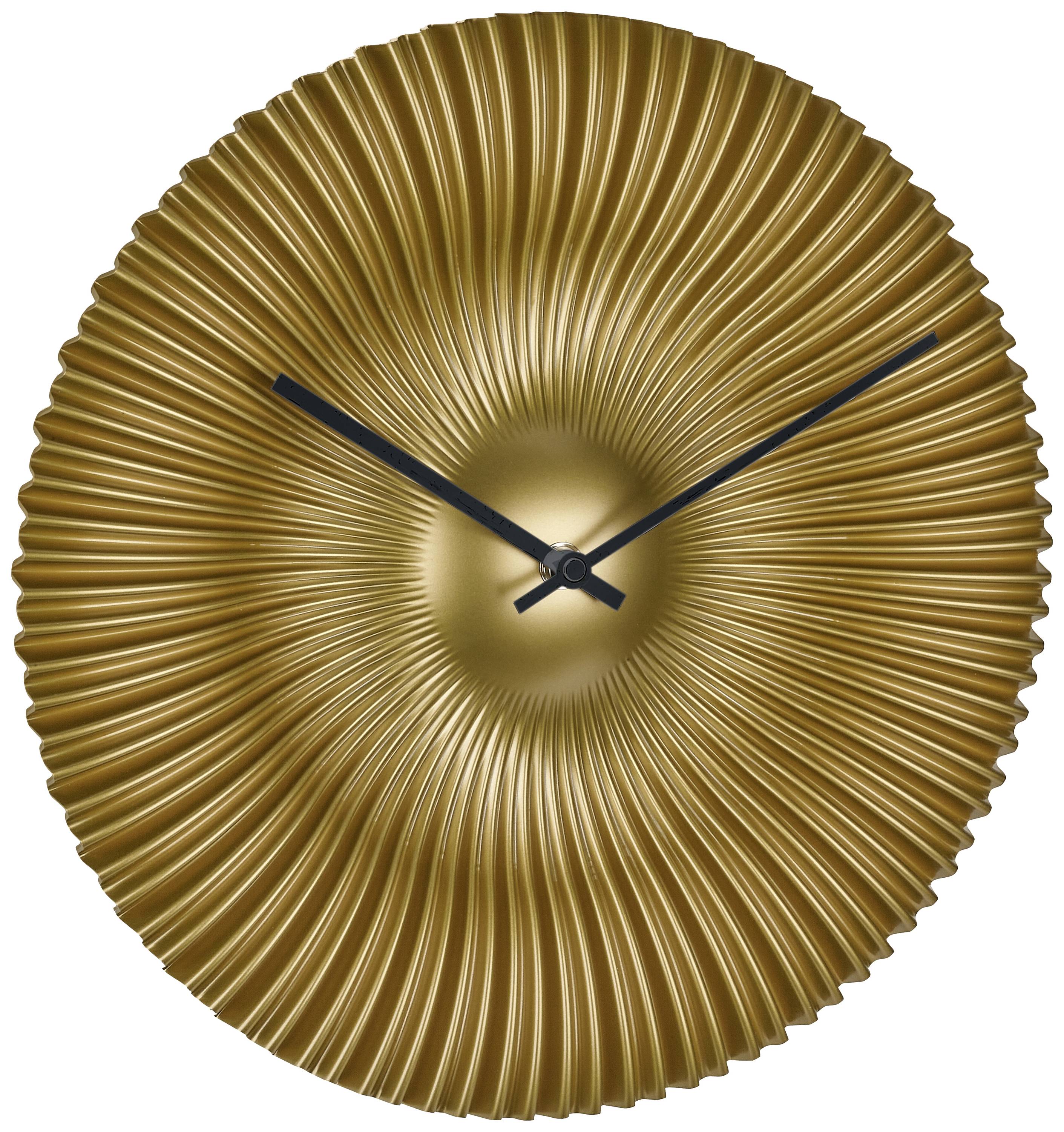 Golden wall clock with a wave-like design and black hands. It displays the time as 10:10.