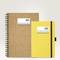 Two notebooks: on the left, a spiral-bound cork notebook, on the right, a yellow book with 'PROJECT NOTES' labels on both sides.