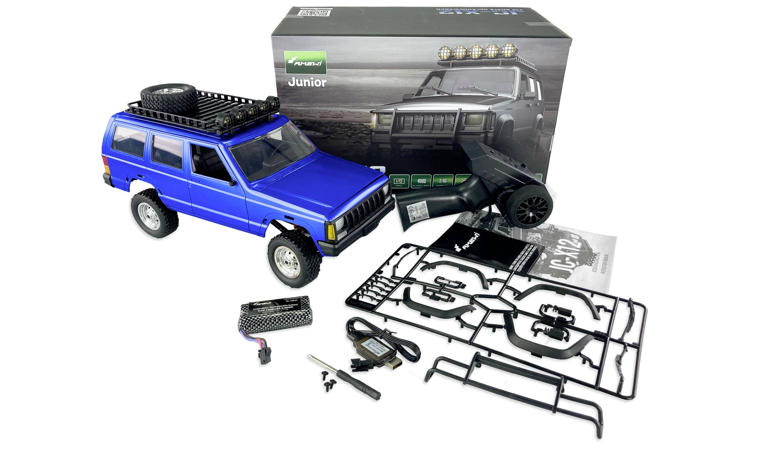 Kit for a remote-controlled car in blue, with accessories such as tyres and tools. Packaging featuring an image of the completed model in the background.