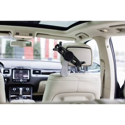 A portable tablet holder is attached to the back of a car seat. The interior of the car is well-lit.