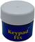 A small blue container with a white lid, labelled 'Keypad Fix'.