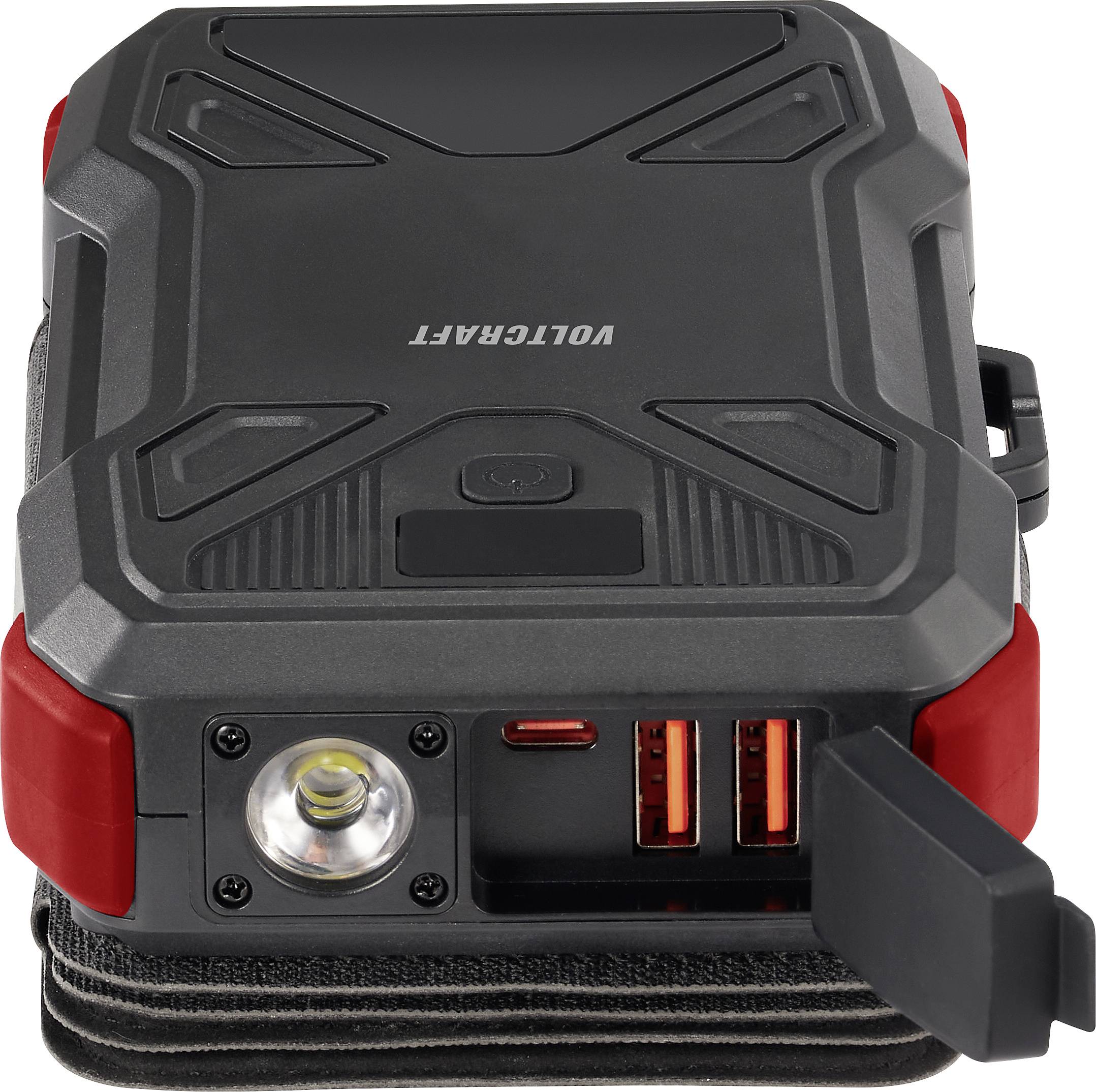 A portable charger with a robust design, featuring two USB ports and an integrated torch, shown in close-up.