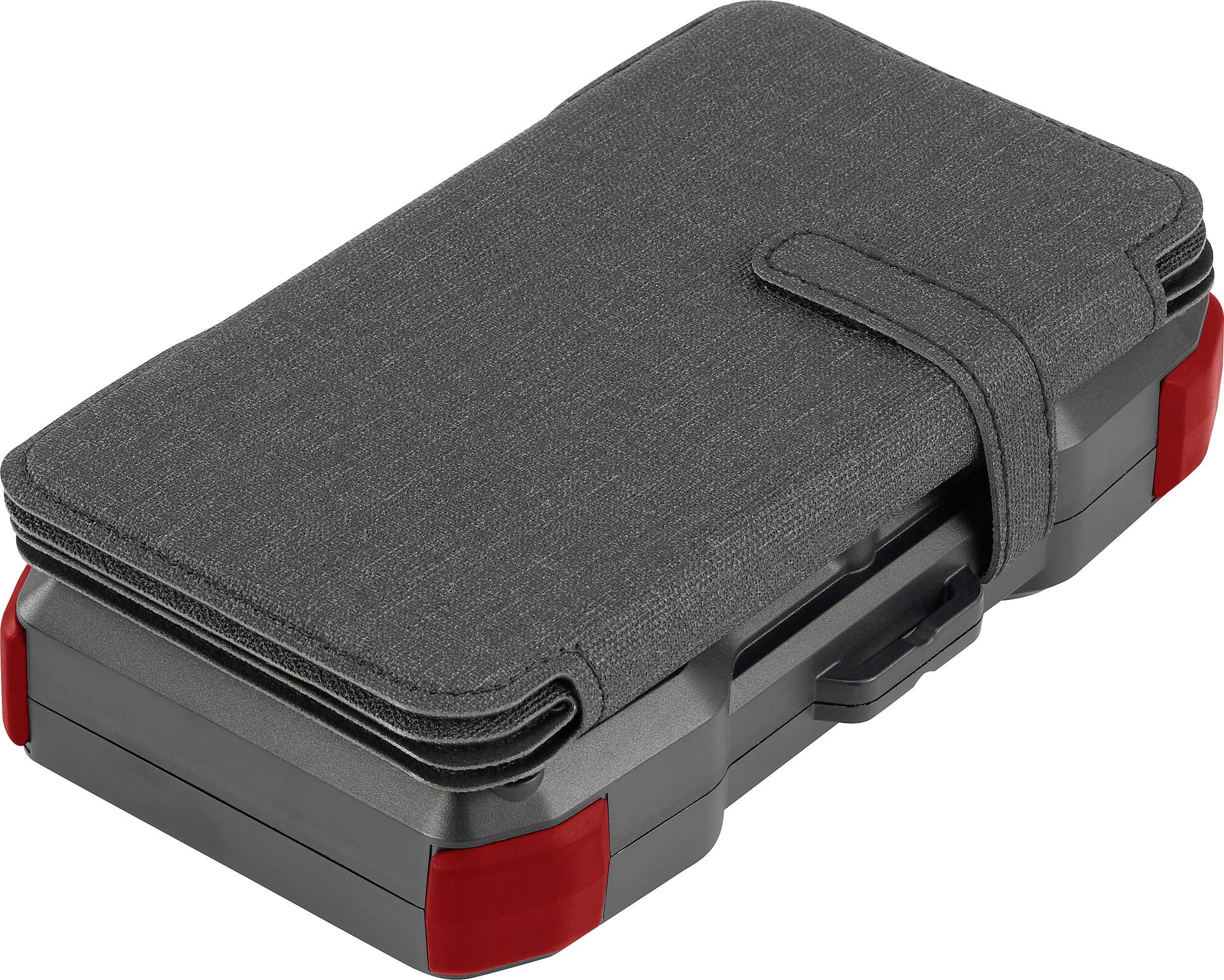A closed, dark protective case for an electronic device, with red corner accents and a fastening strap.