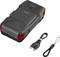 'Jump starter device with a USB cable and a small hand strap beside it. The device is black with red accents.'