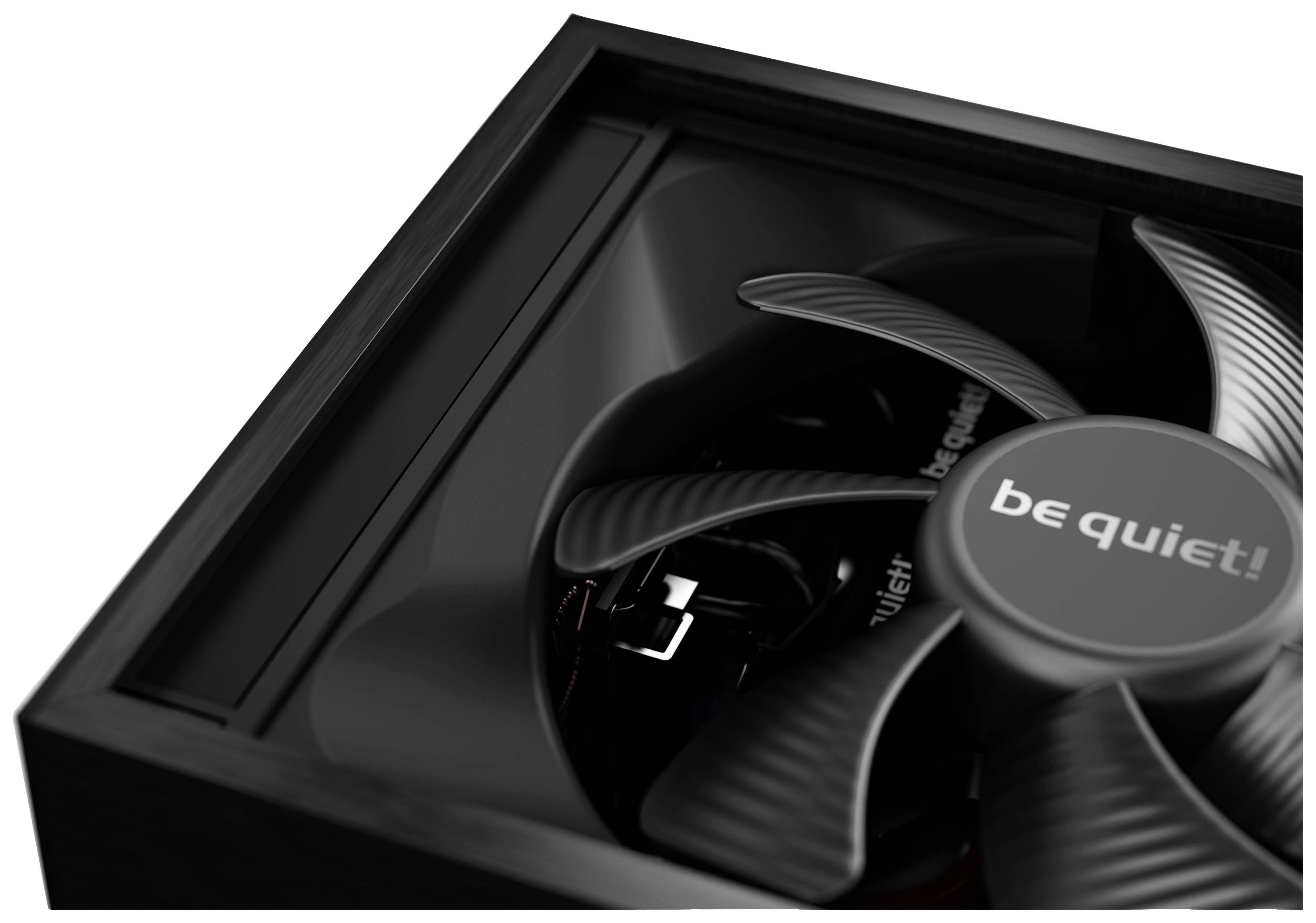 A black computer fan inside a case with 'be quiet!' written on the fan cover.