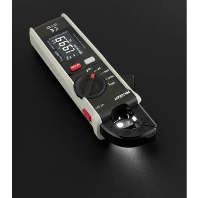 A digital multimeter with an LCD display shows '9.67'. It has a rotary switch for various measurement modes and an LED indicator light.