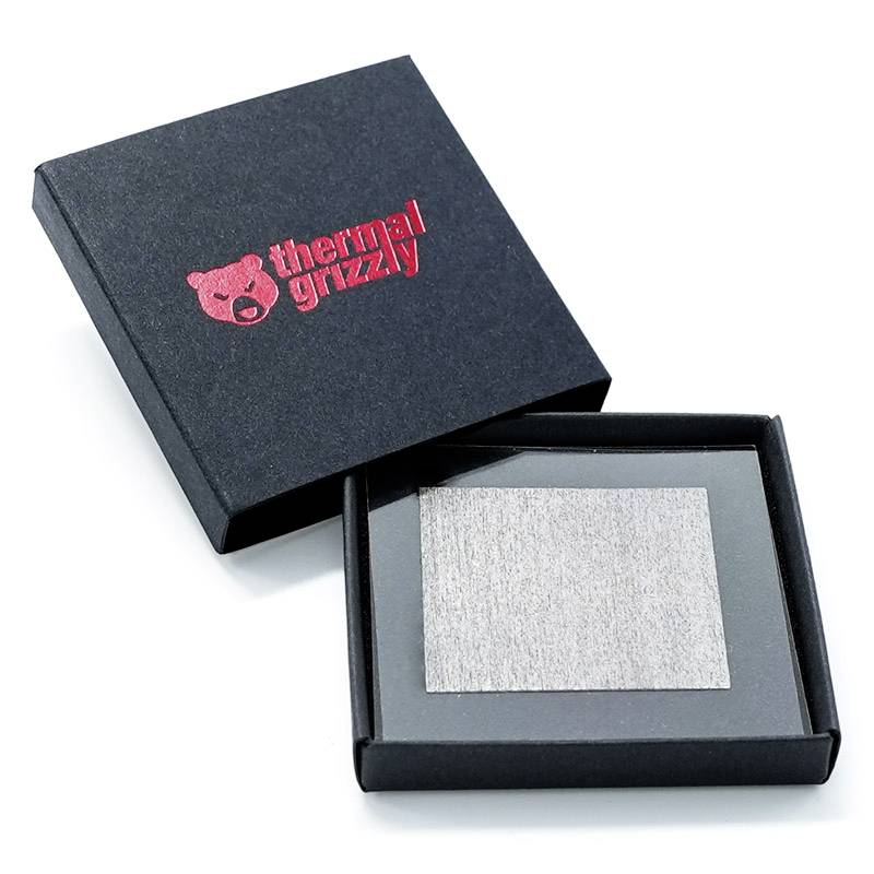 Black packaging with red 'Thermal Grizzly' logo, contains a square metal plate.