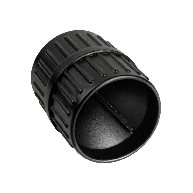 Black, ribbed plastic cylinder, presumably a cap or cover, viewed from above.
