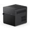 A compact, black mini PC with a ventilated surface and multiple ports on the front panel.