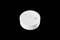 A white smoke detector with a test button and an acoustic opening, against a black background.