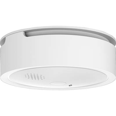 A circular smoke detector, white, with ventilation slots and a test button, mounted on a ceiling. Primarily for fire safety.<br><br>Note: The translation is in British English, maintaining the original description's conciseness and technical accuracy.