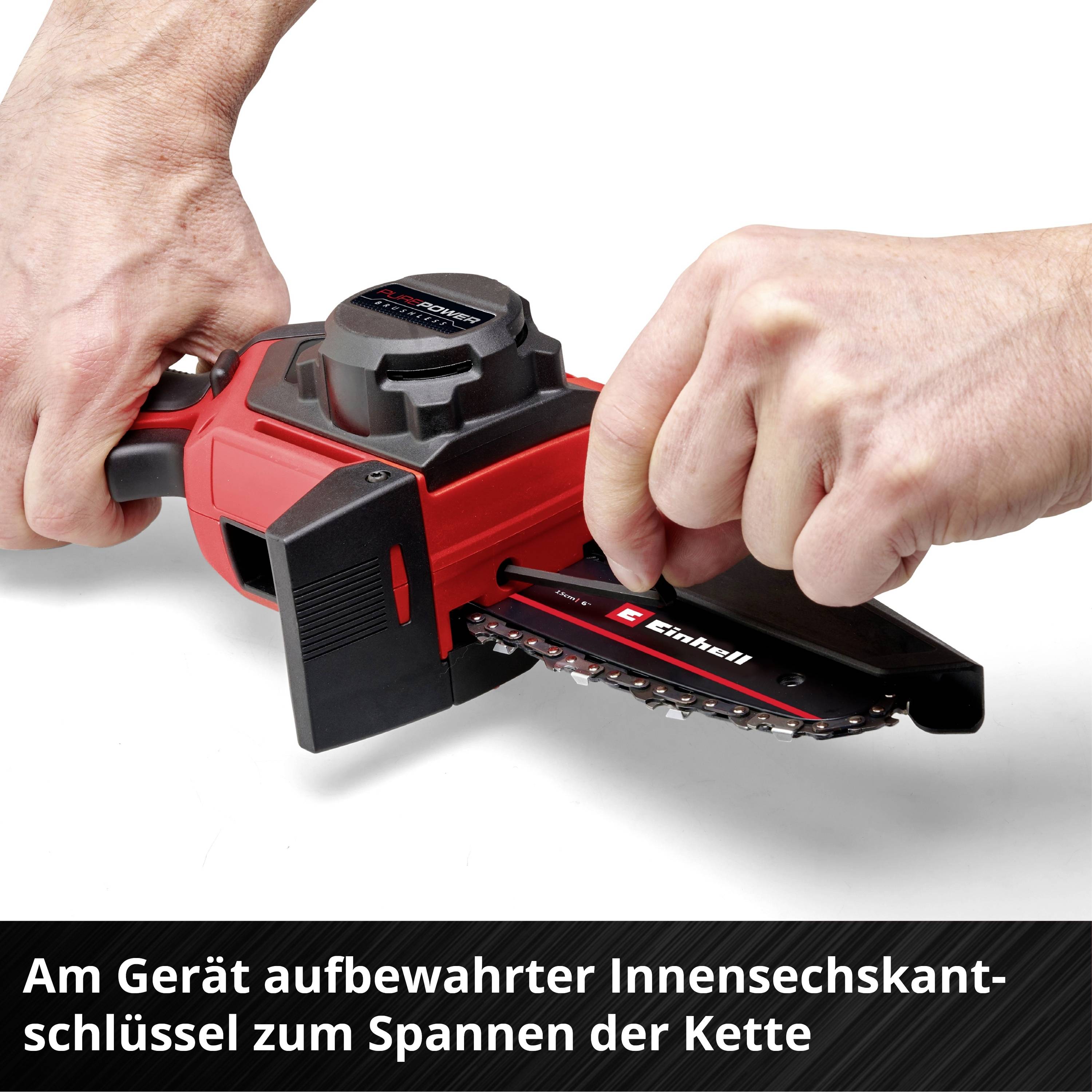 Two hands operating a red chainsaw. Text in image: 'Hex key stored on the device for tensioning the chain'