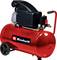Red Einhell portable air compressor with tank, handle, wheels, pressure gauges, and motor unit on top.