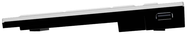 Side view of a slim, slightly angled keyboard with black keys and a USB port opening on the right-hand side.